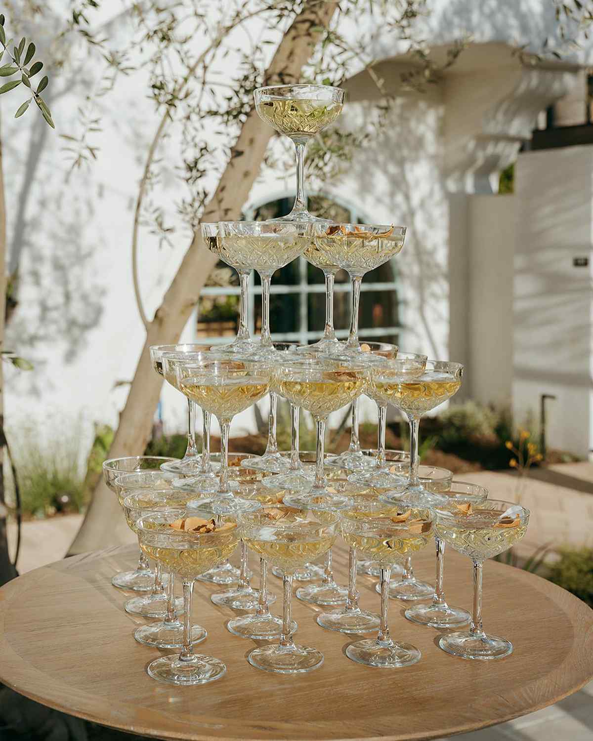 Tower of Italian sparkling wine glasses on a table