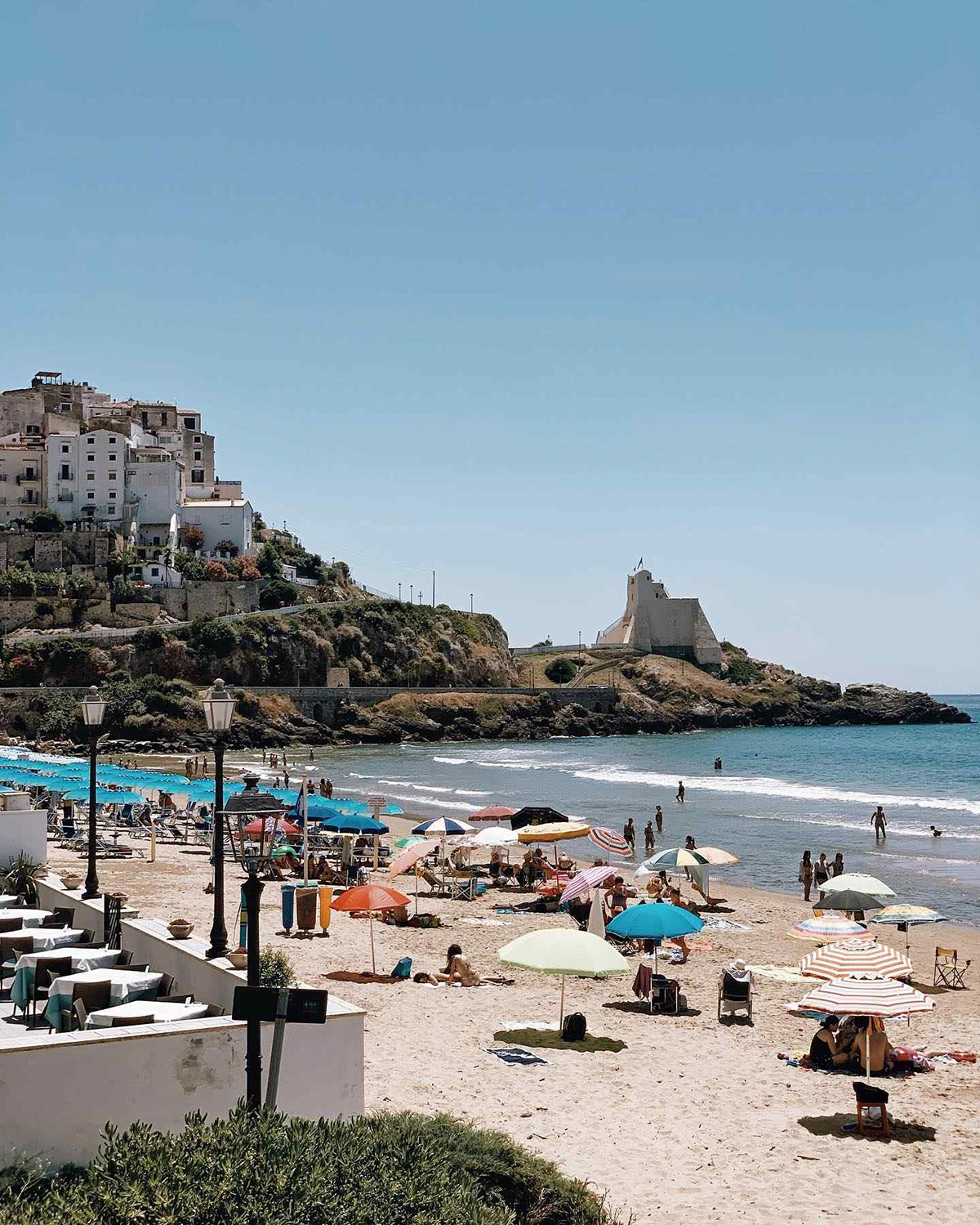 Beach with white sand and umbrellas on the beach