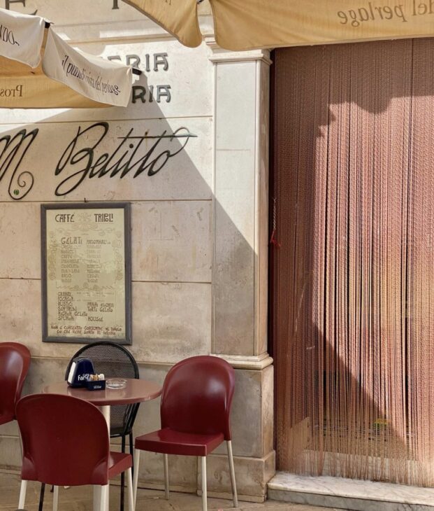 An Italian bar in the day in the sun.